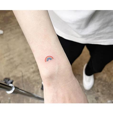 tiny rainbow tattoo